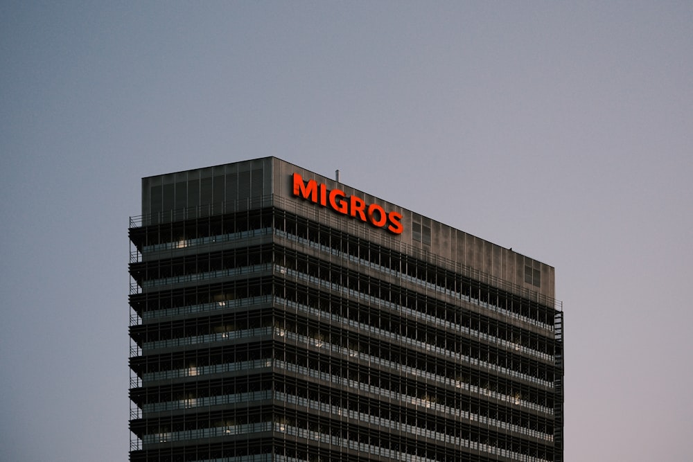 a tall building with a sign on top of it