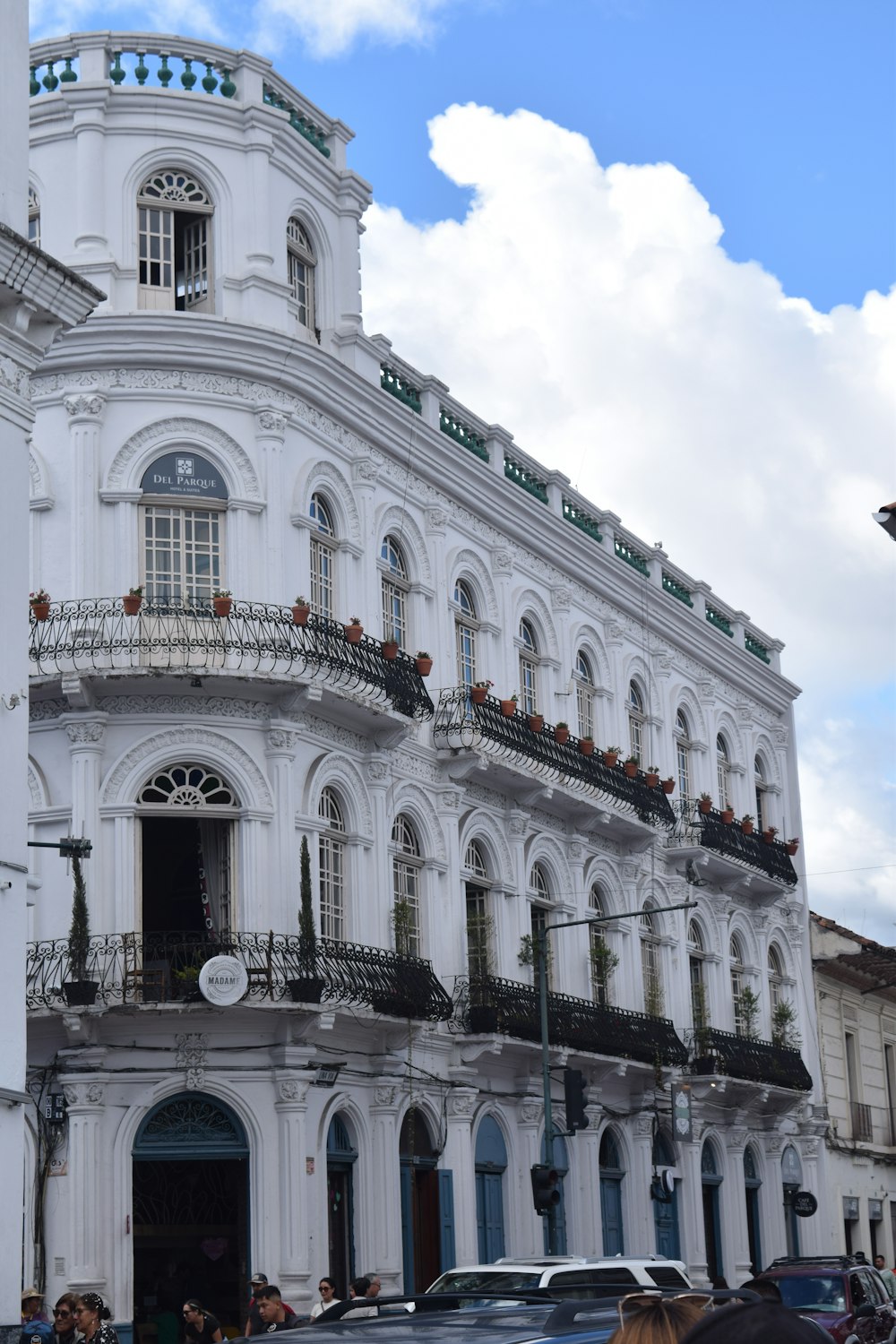 a large white building with many balconies