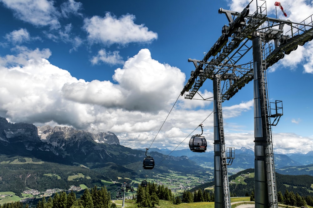 a ski lift going up the side of a mountain