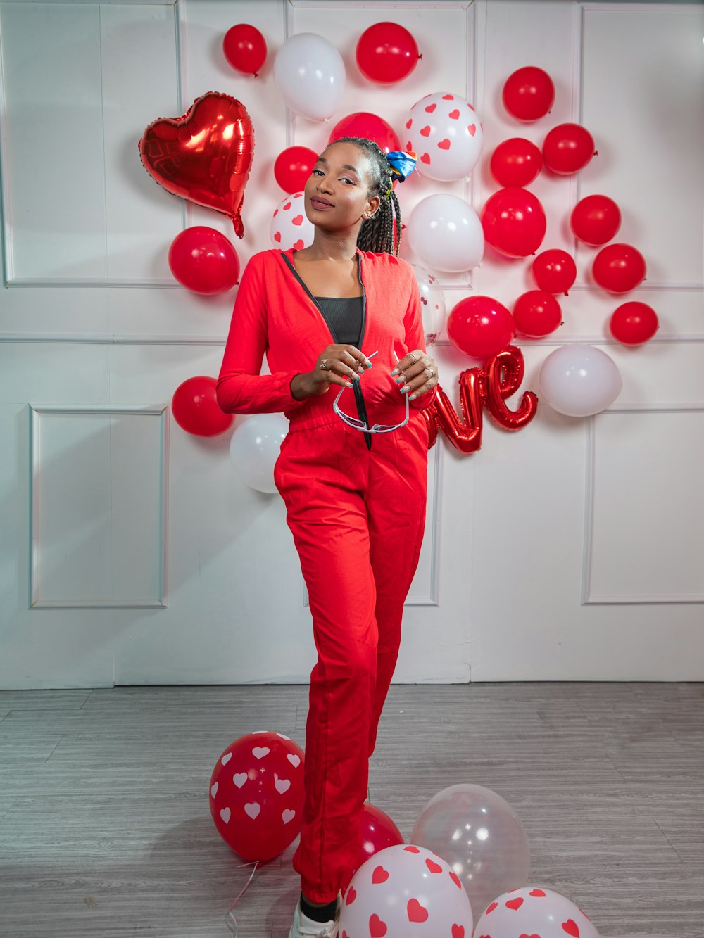 a woman standing in front of balloons and balloons