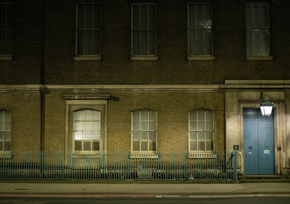 a building with a blue door at night
