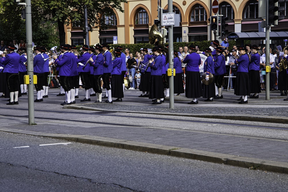 a group of people that are standing in the street