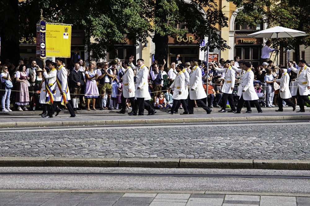 a group of people walking down a street