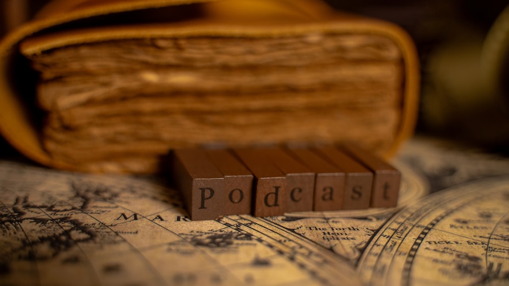 a close up of a book and a wooden block