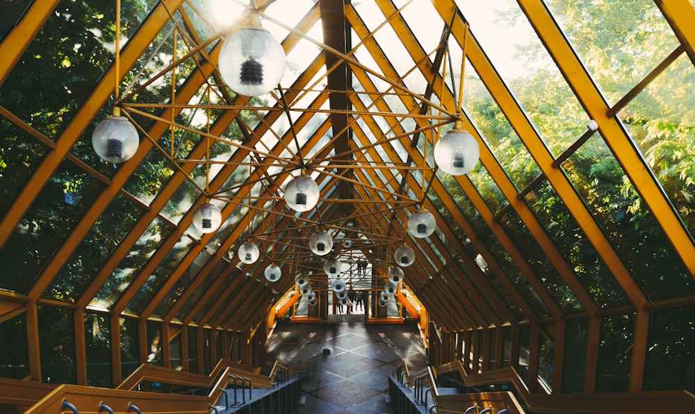 a long hallway with lots of lights hanging from the ceiling