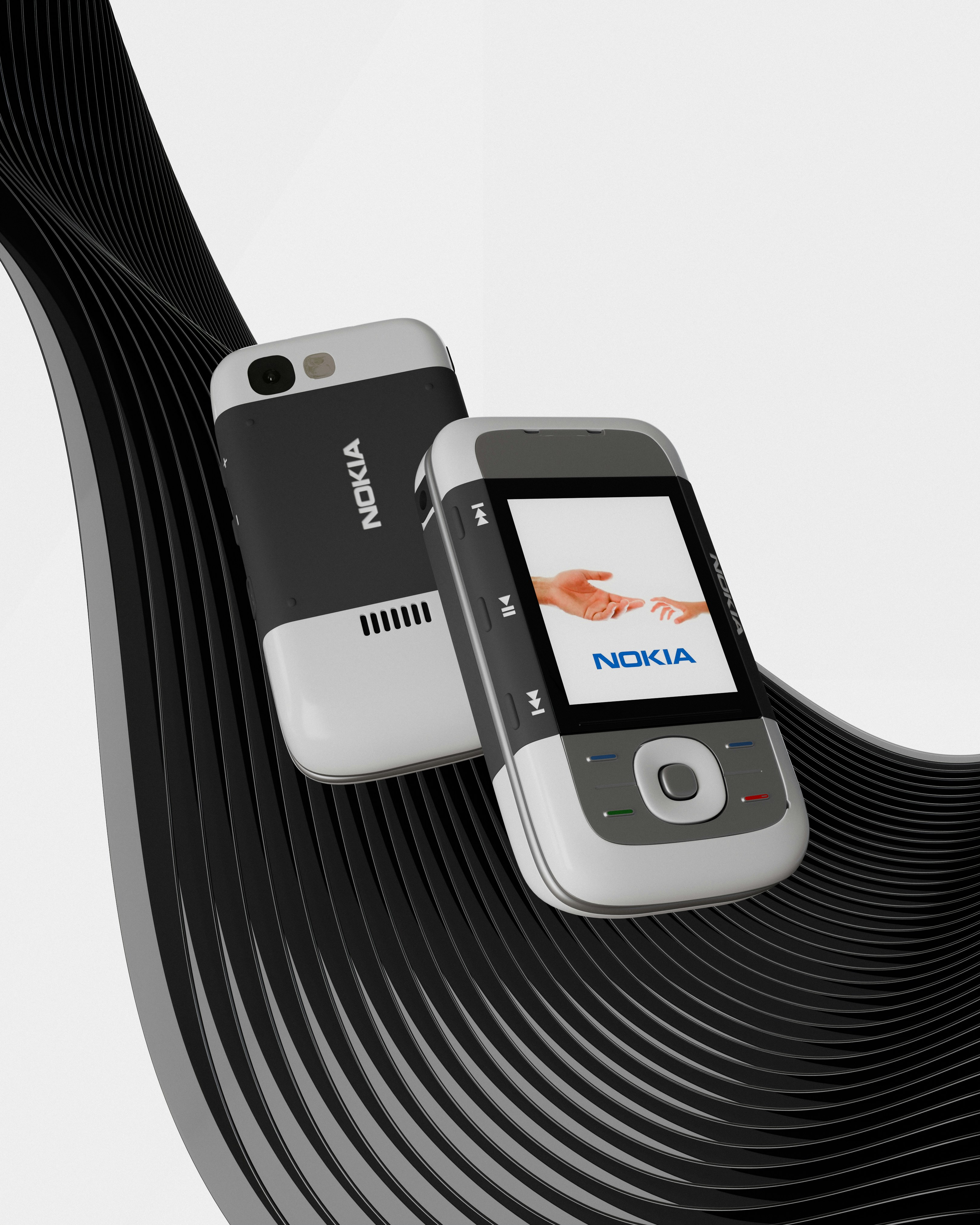 un telefono cellulare seduto in cima a un'onda in bianco e nero