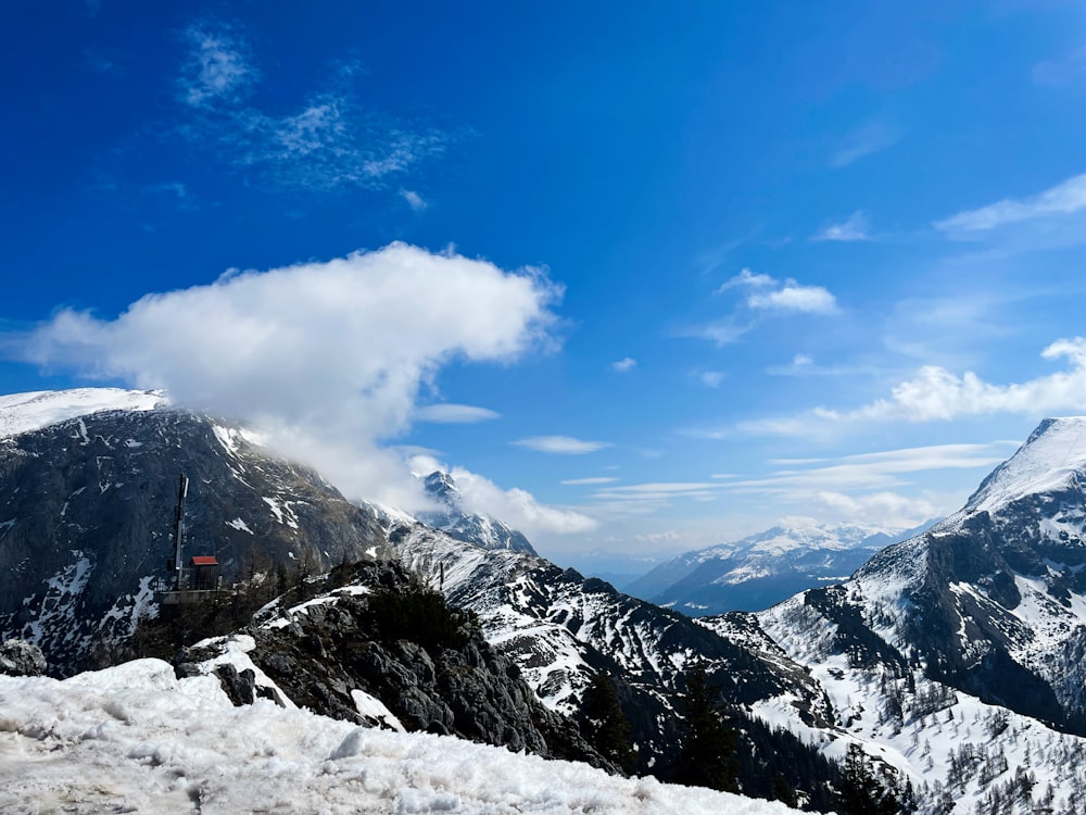 a view of a mountain range covered in snow