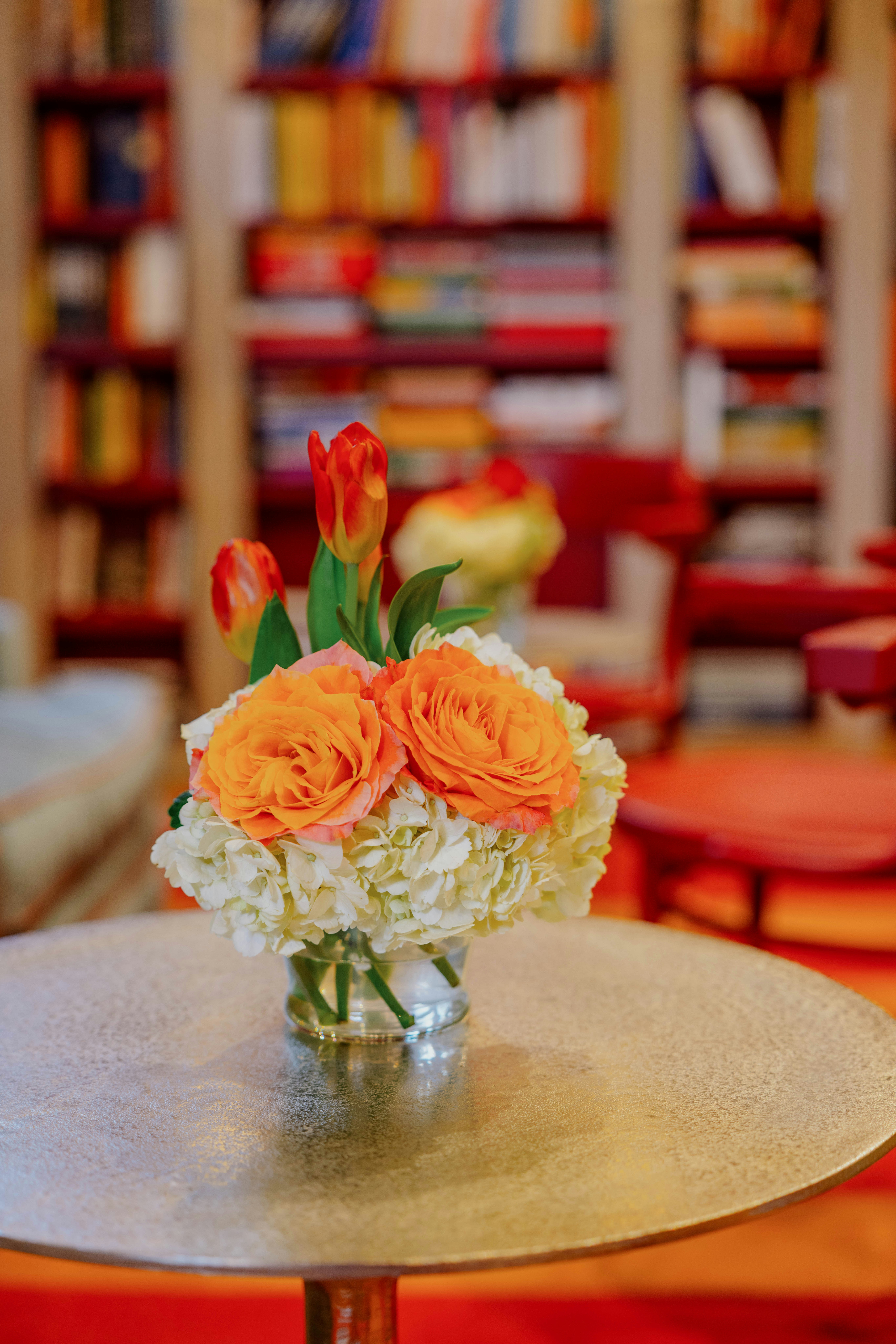 A vase filled with flowers sitting on top of a table photo – Free ...