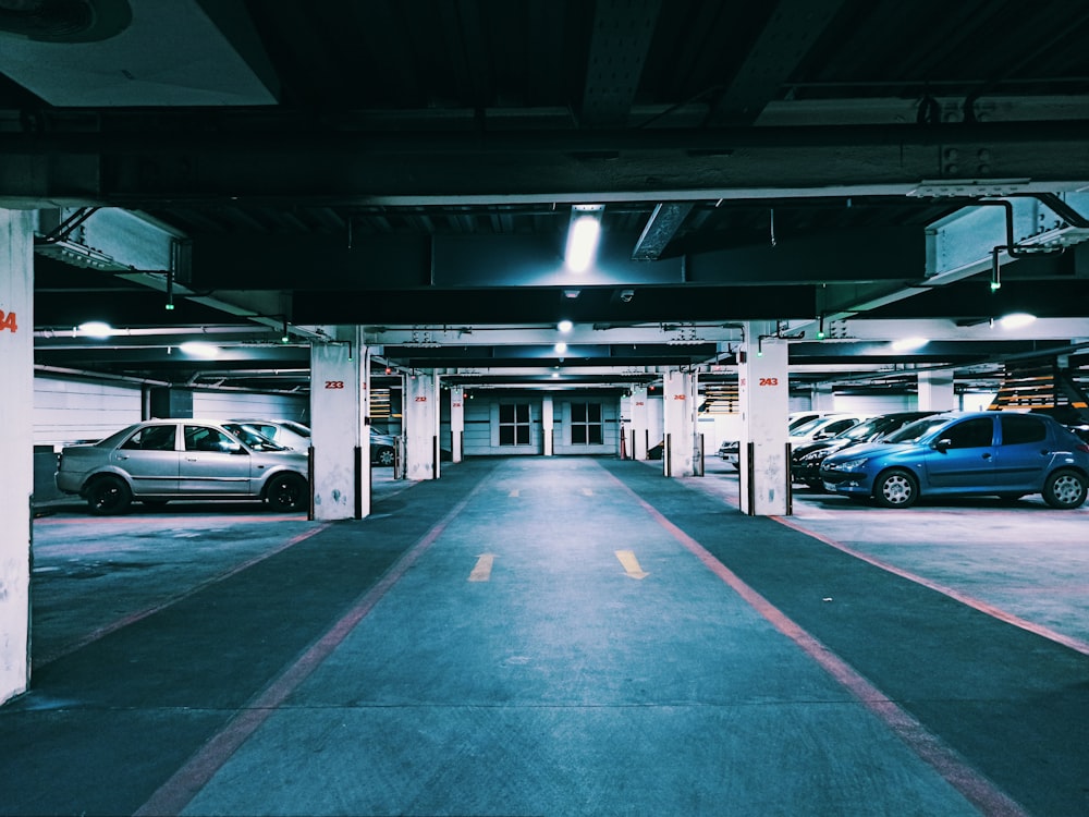 a parking garage with several cars parked in it