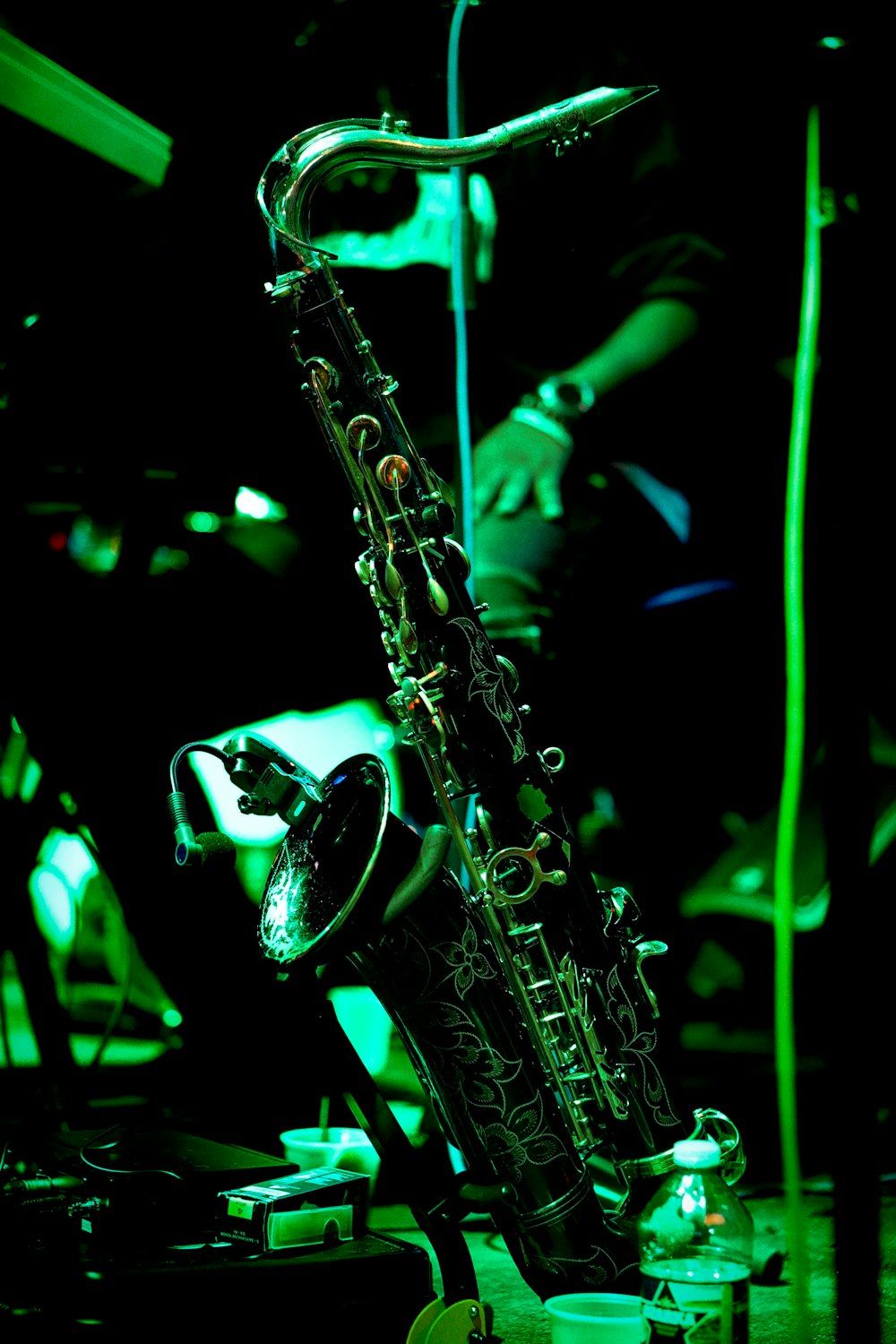 a saxophone sitting on top of a wooden table