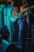 a person playing a guitar on a stage