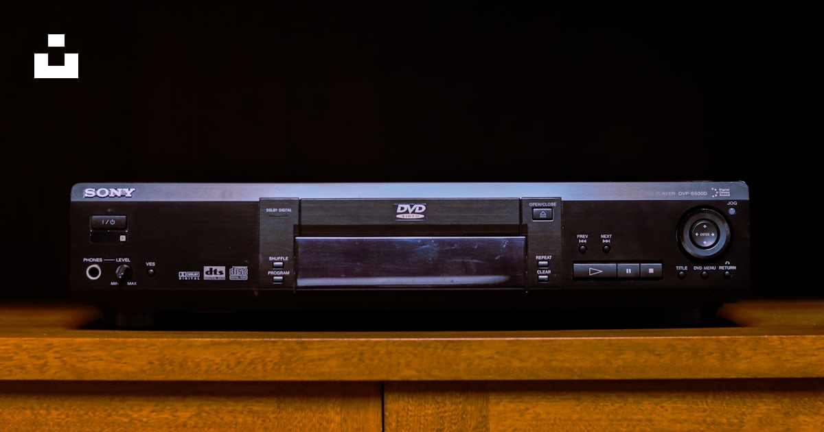 A sony dvd player sitting on top of a wooden table photo – Free Grey ...