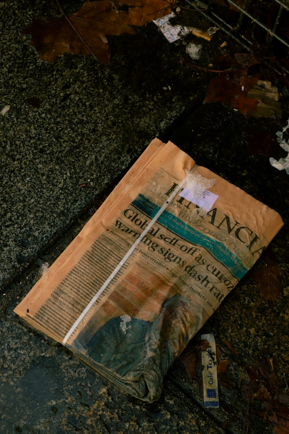 an old newspaper laying on the ground