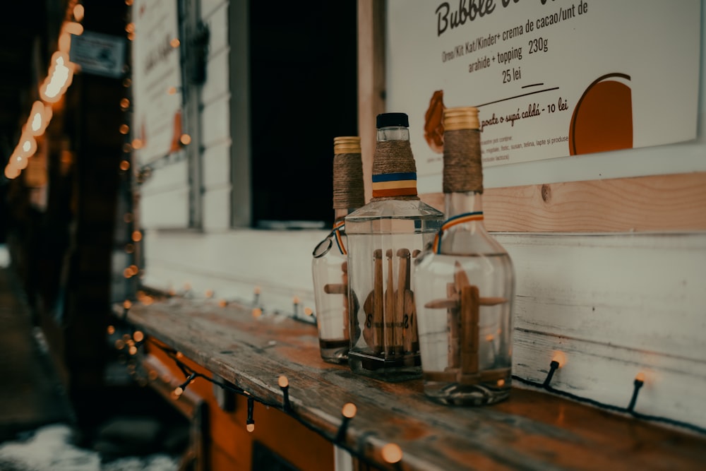 a couple of bottles sitting on top of a wooden table