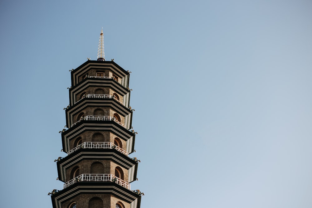 a tall tower with a clock on the top of it