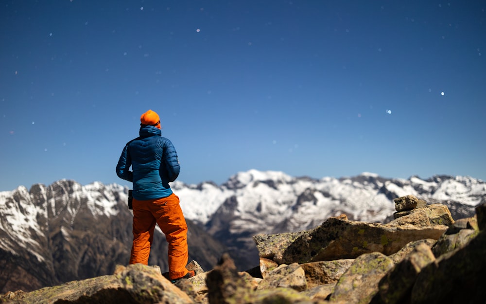 a person standing on top of a rocky mountain