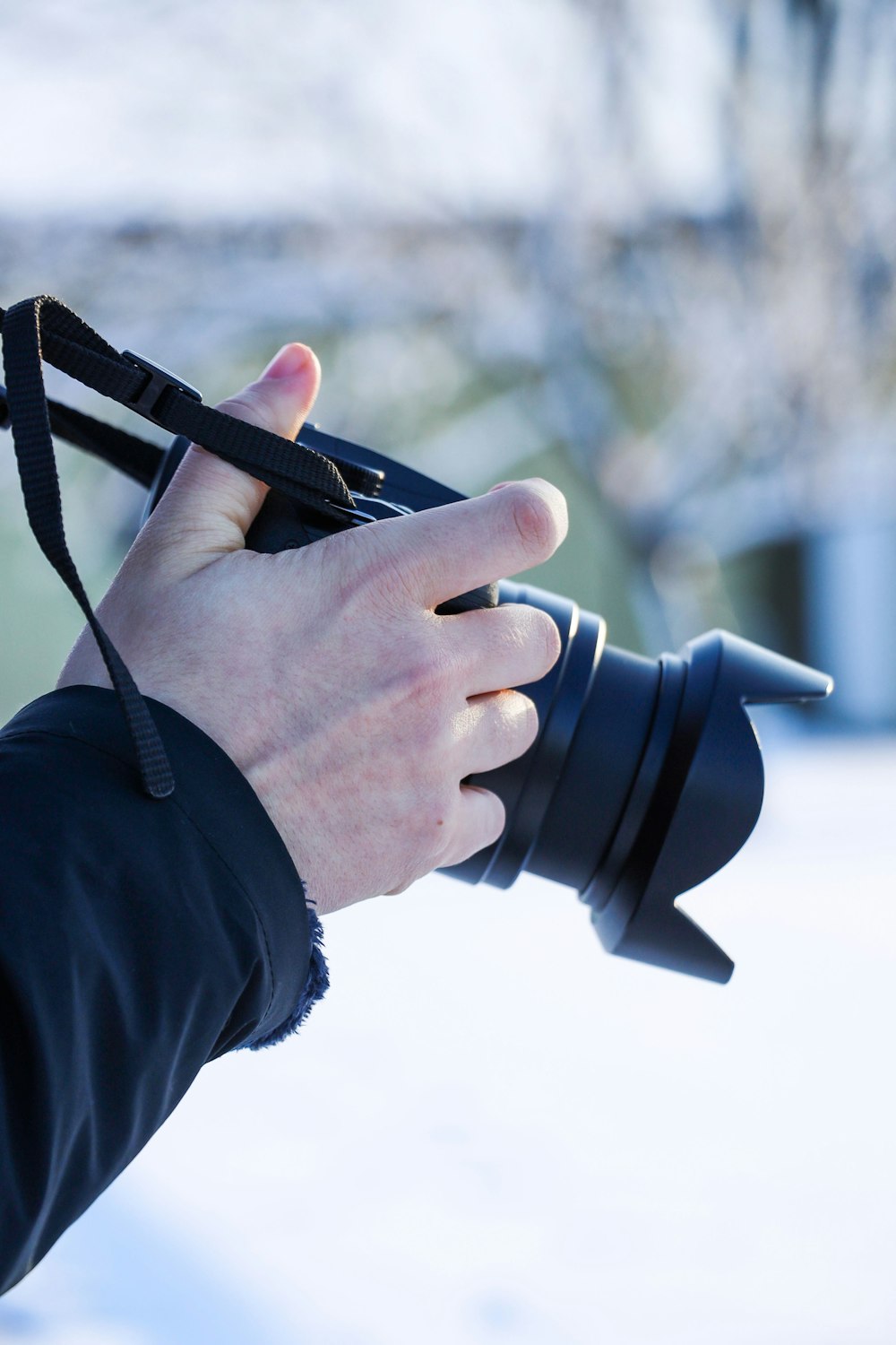 a person holding a camera in their hand