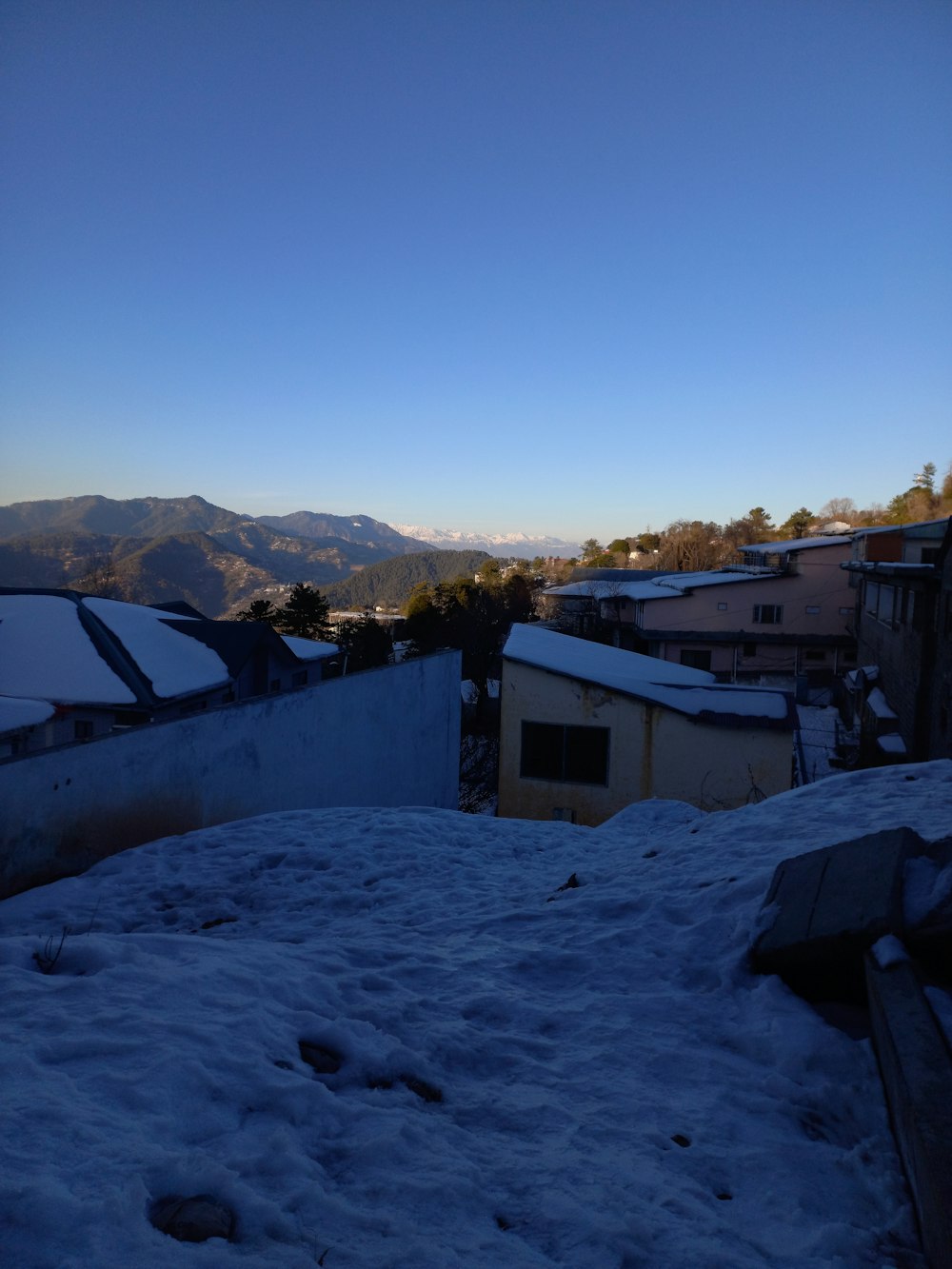 a view of a city with mountains in the background