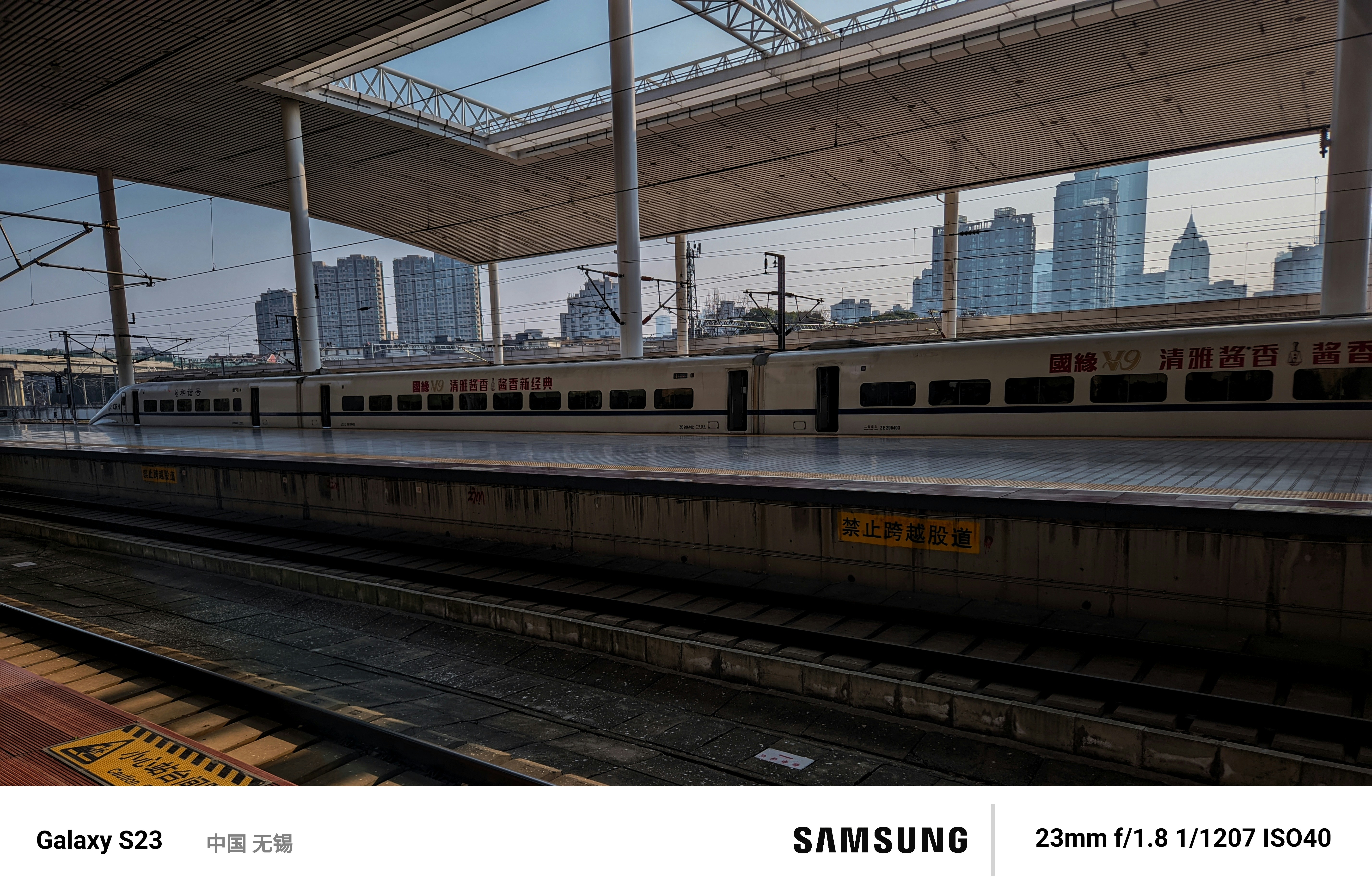 a train station with a train on the tracks