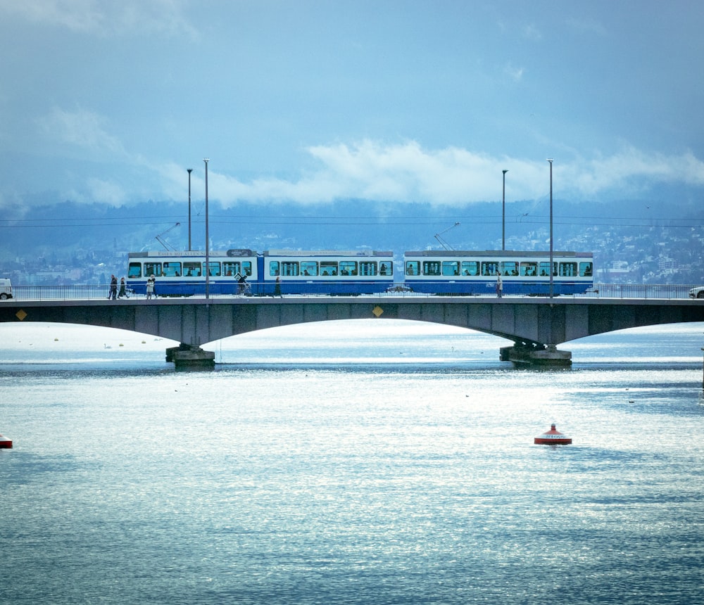 a train on a bridge over a body of water