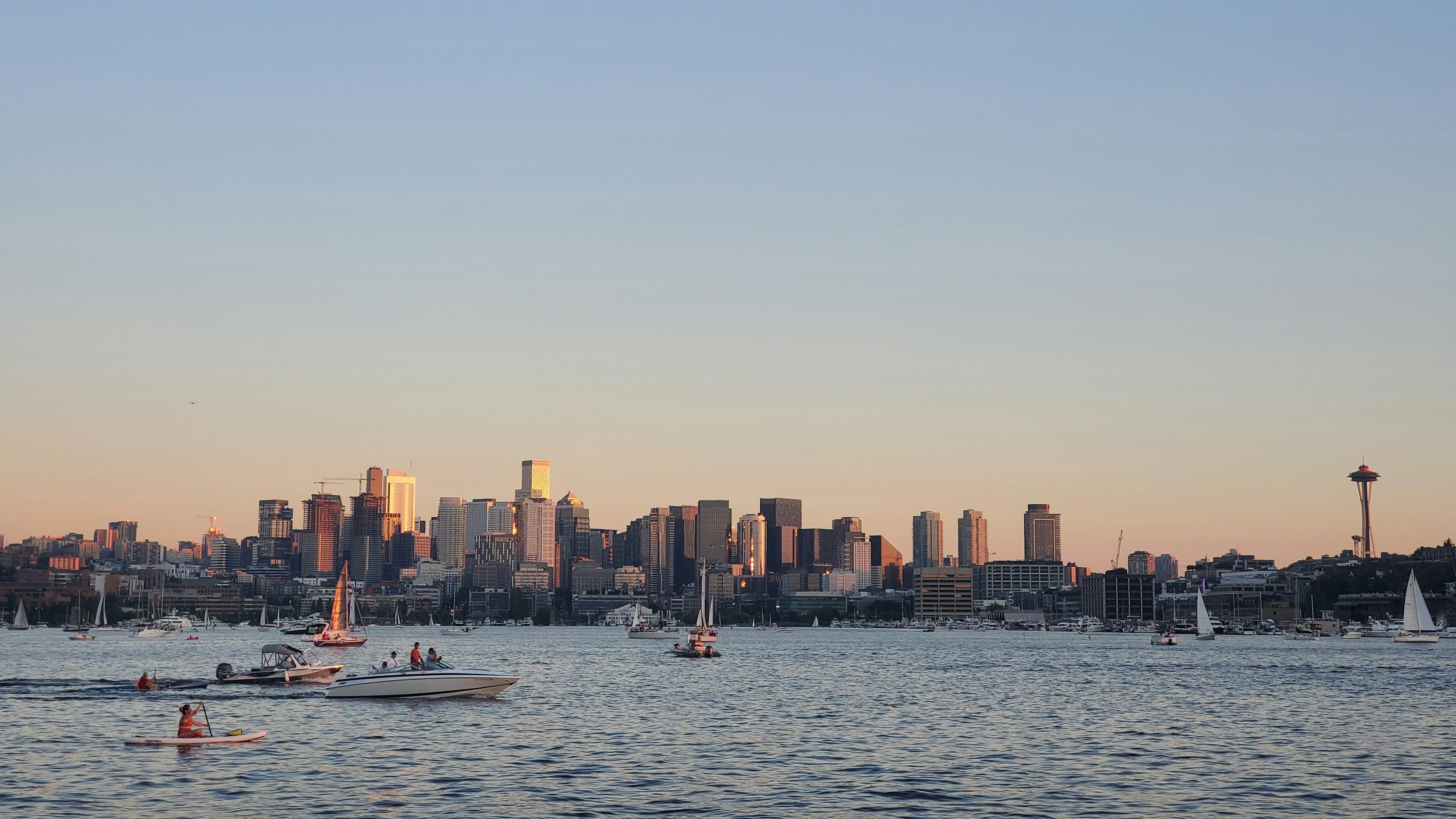 a group of boats floating on top of a large body of water