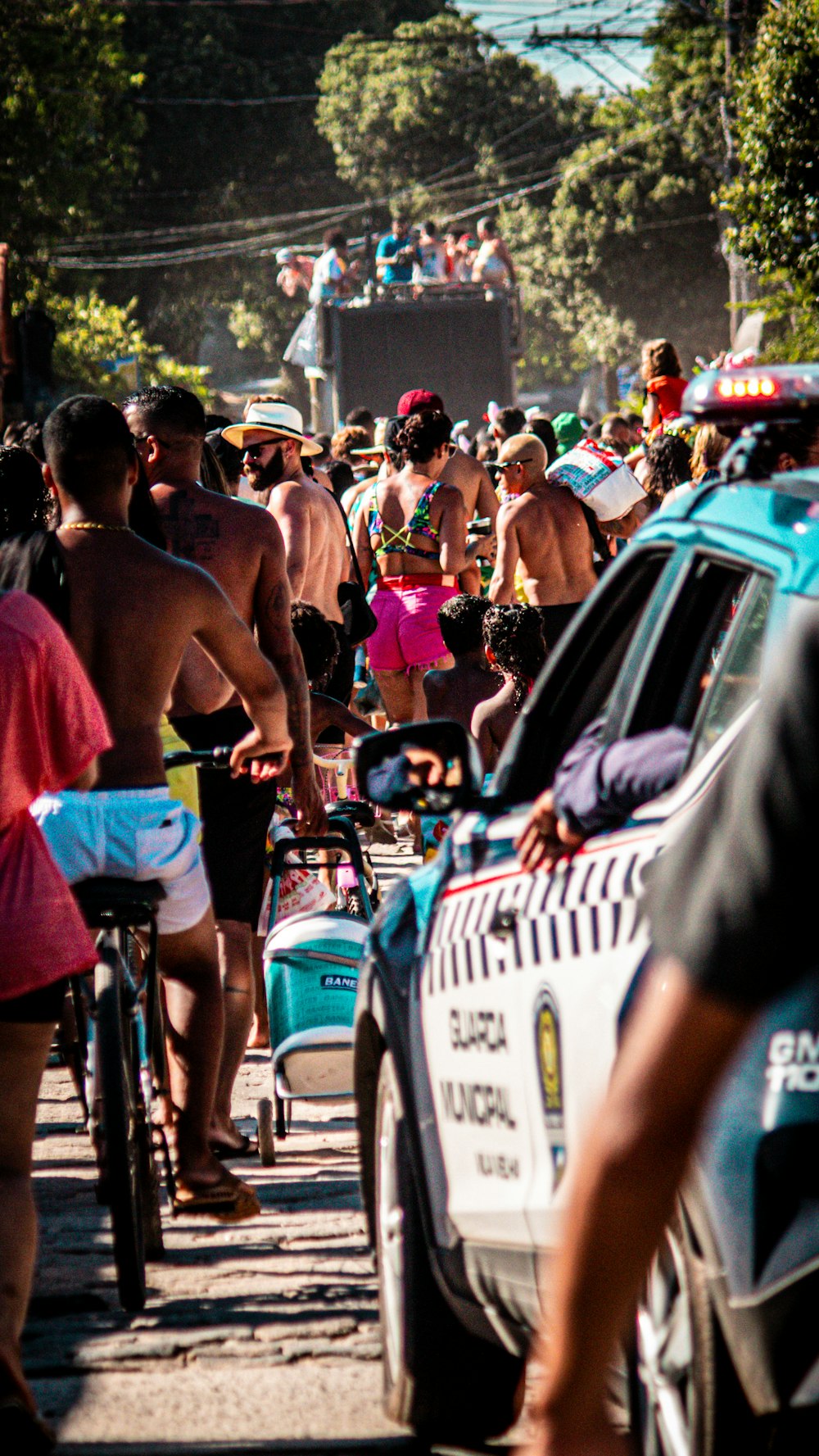 a group of people riding bikes down a street