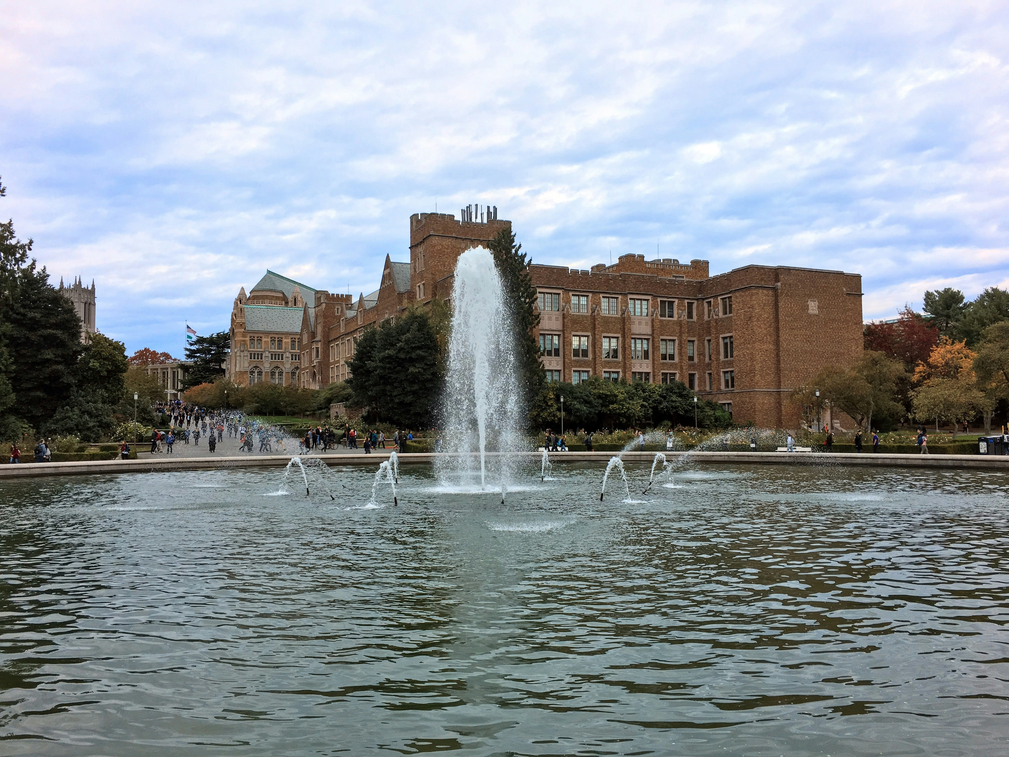 a water fountain with a building in the background