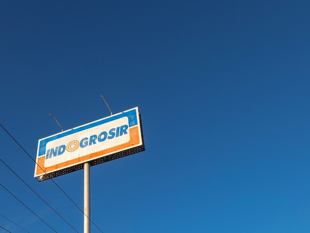 a large billboard on top of a pole