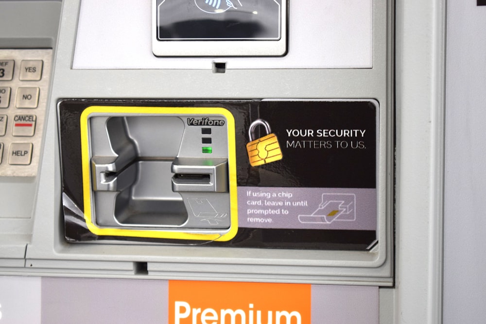 an atm machine with a yellow lock on it
