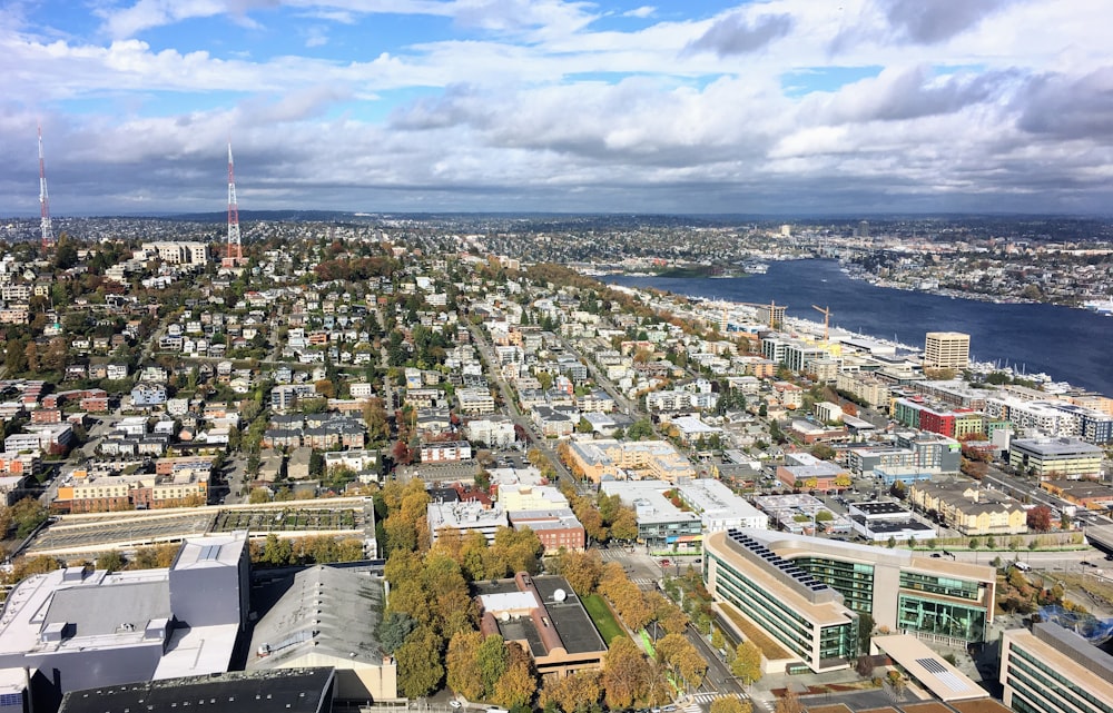 an aerial view of a city and the ocean