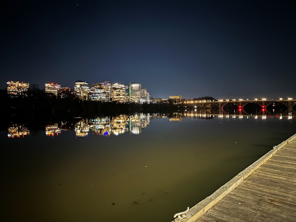 a view of a city at night from a pier