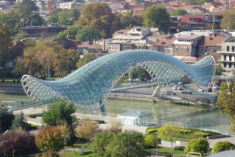a large bridge over a river next to a city