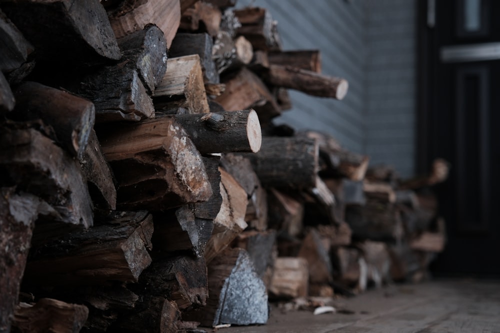 a pile of wood sitting on top of a wooden floor