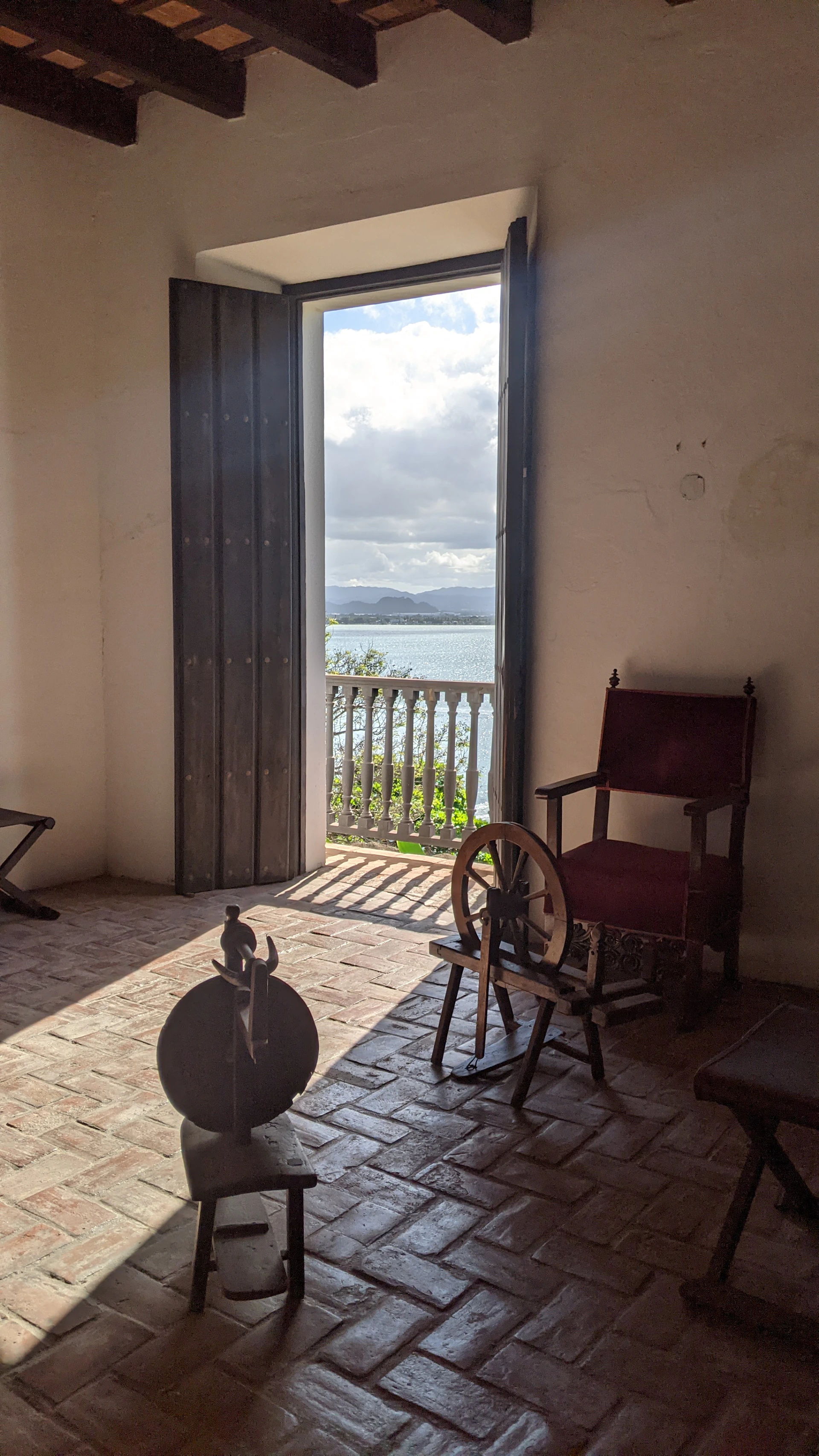 a room with a door that leads to a balcony