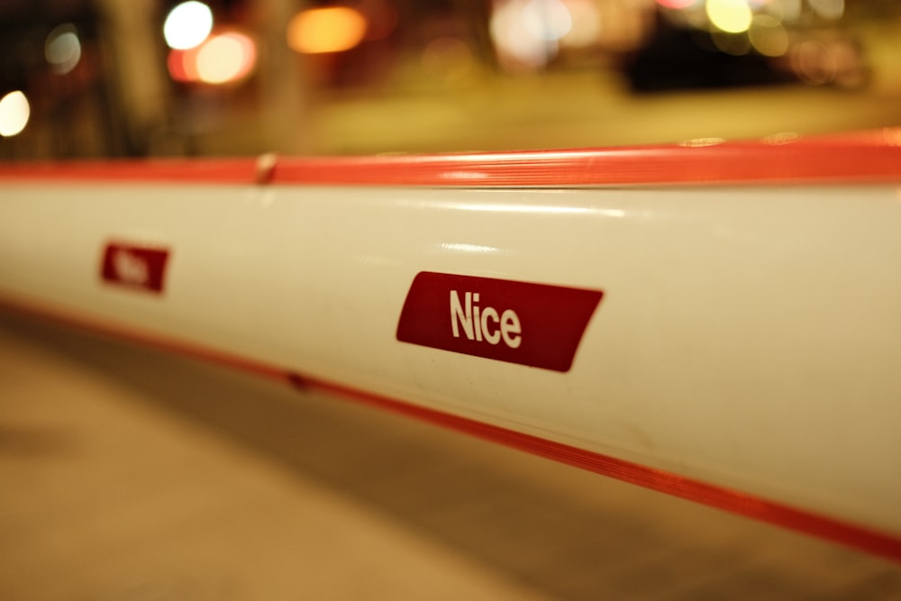 a close up of a red and white pipe