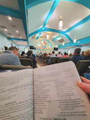 a person holding a book in their hand