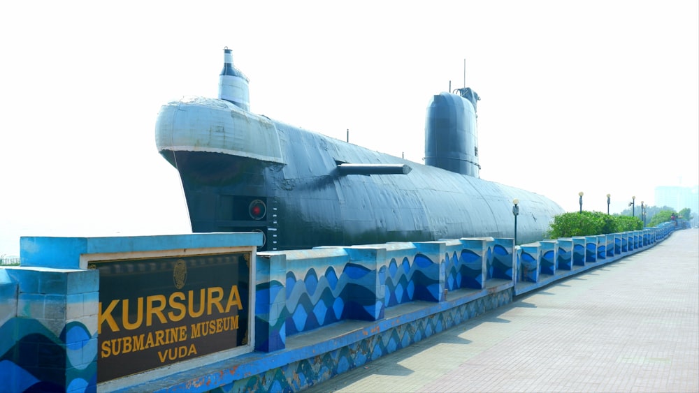 a large submarine sitting on top of a bridge
