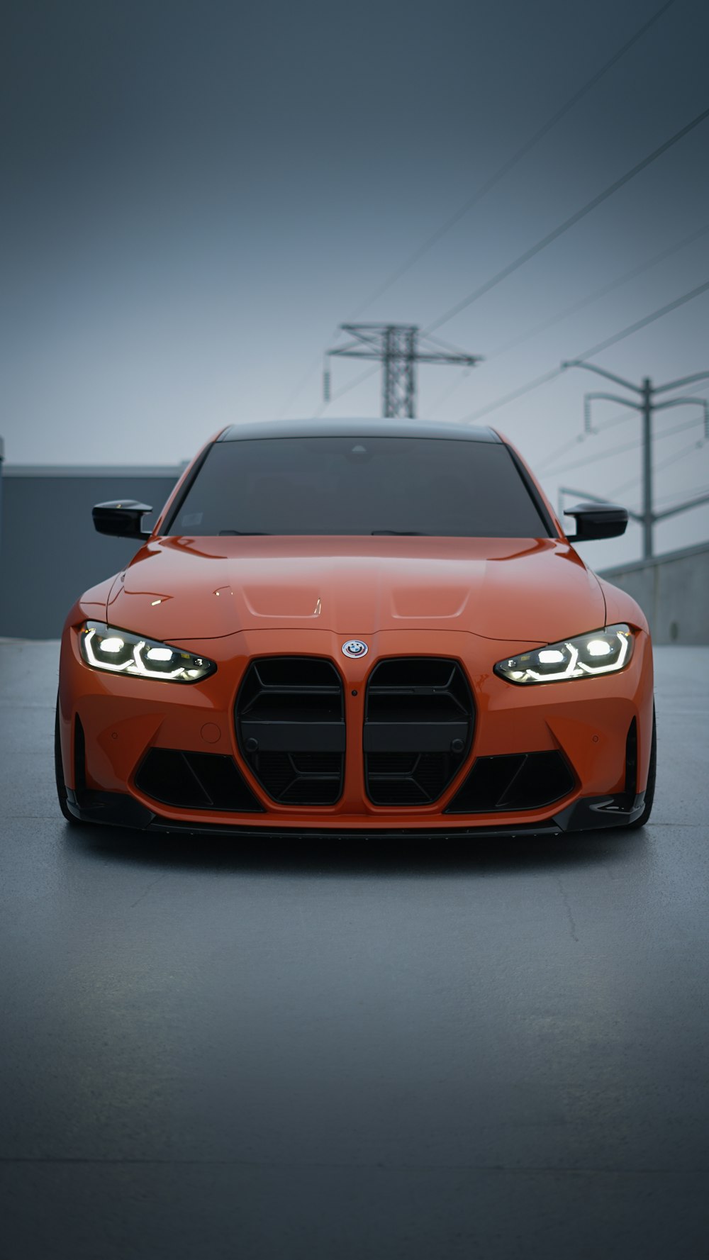 an orange sports car parked in a parking lot