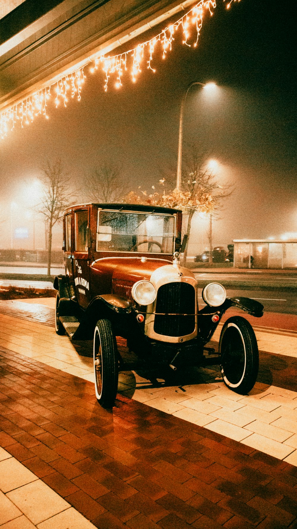 a vintage car parked on the side of the road