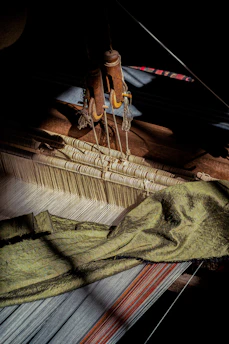 a close up of an old weaving machine