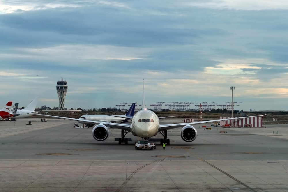 a large jetliner sitting on top of an airport tarmac