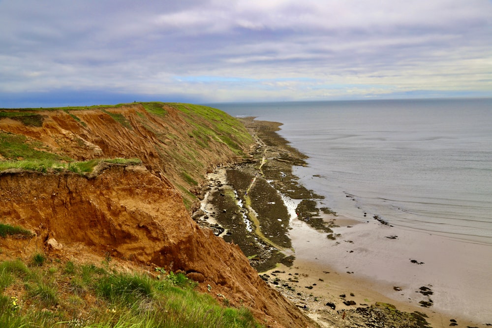 a view of a beach from a cliff