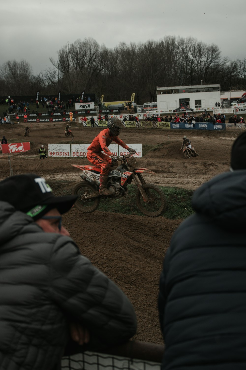 a man riding a dirt bike on top of a dirt field