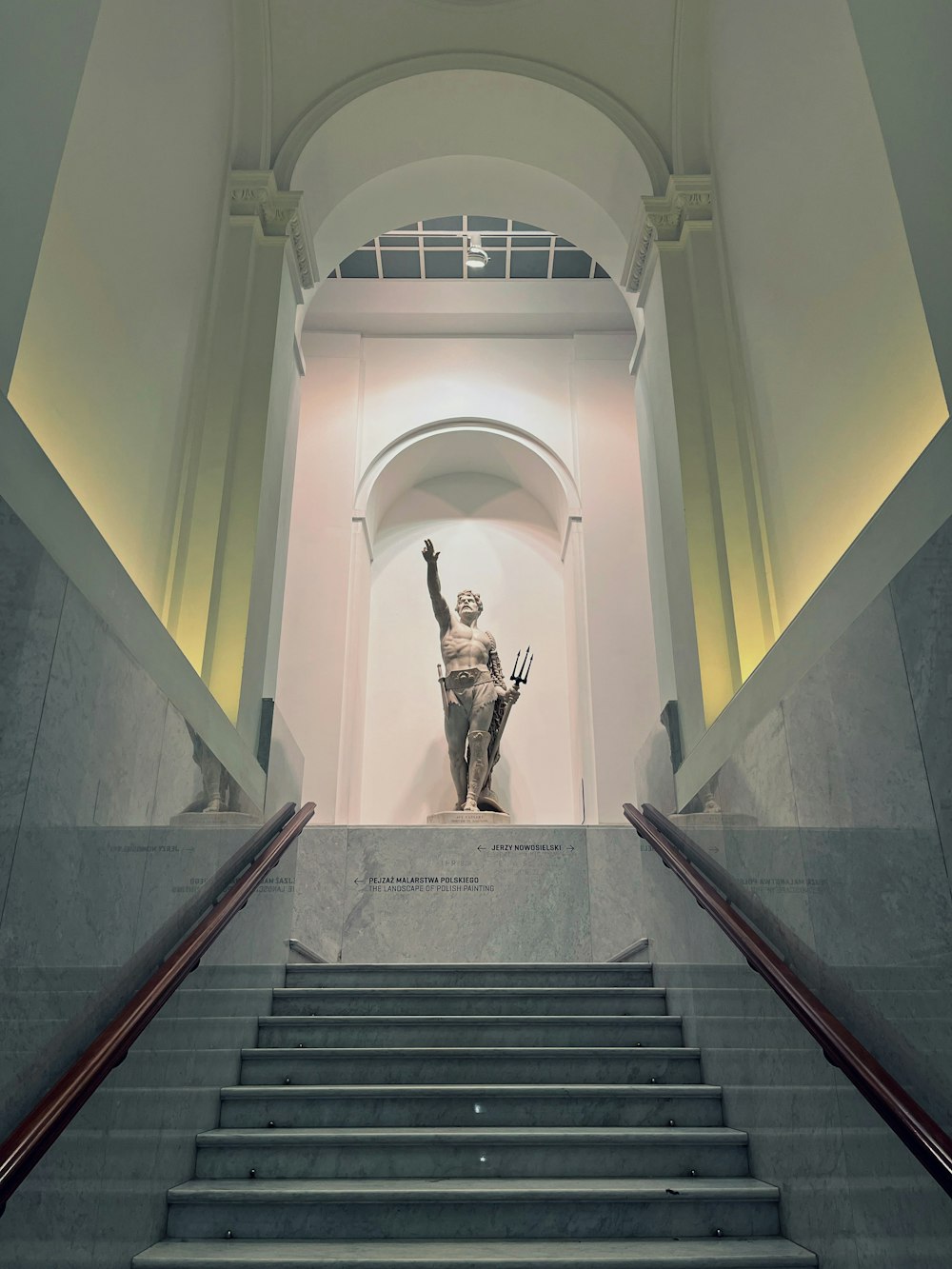 a statue of a person on a staircase