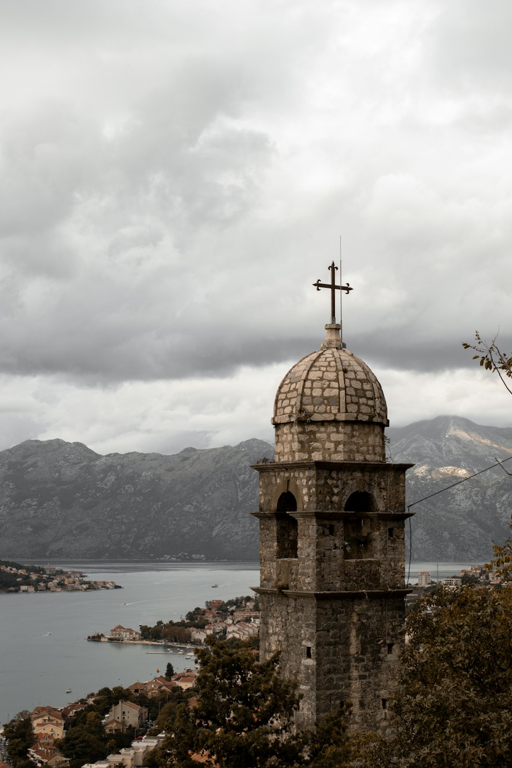 a church tower with a cross on top of it