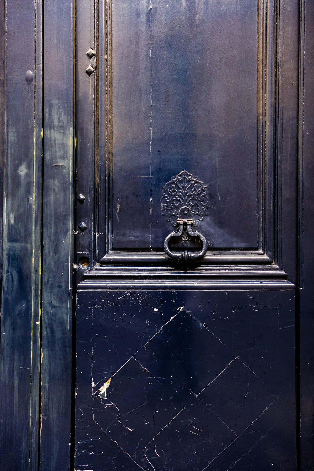 a black door with a metal handle on it