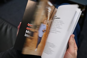 a person holding a book in their hands