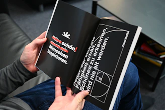 a person holding a book in their hand