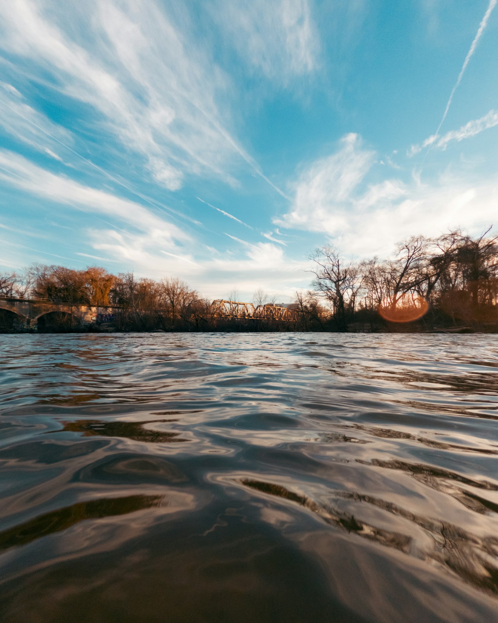 The James River flowing through Richmond Virginia with the city skyline in the background