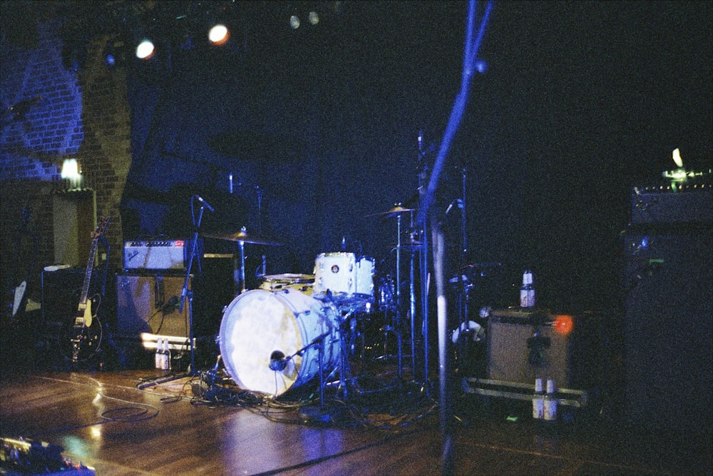 a group of musical instruments sitting on top of a wooden floor